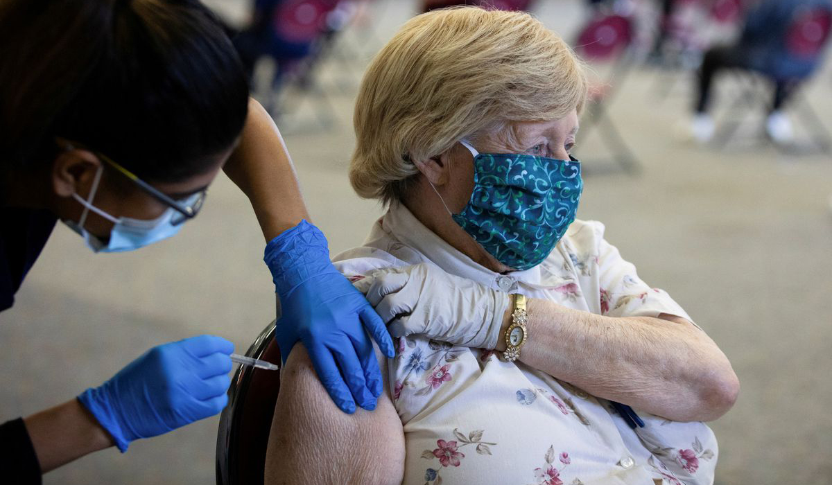 A patient receives COVID vaccine